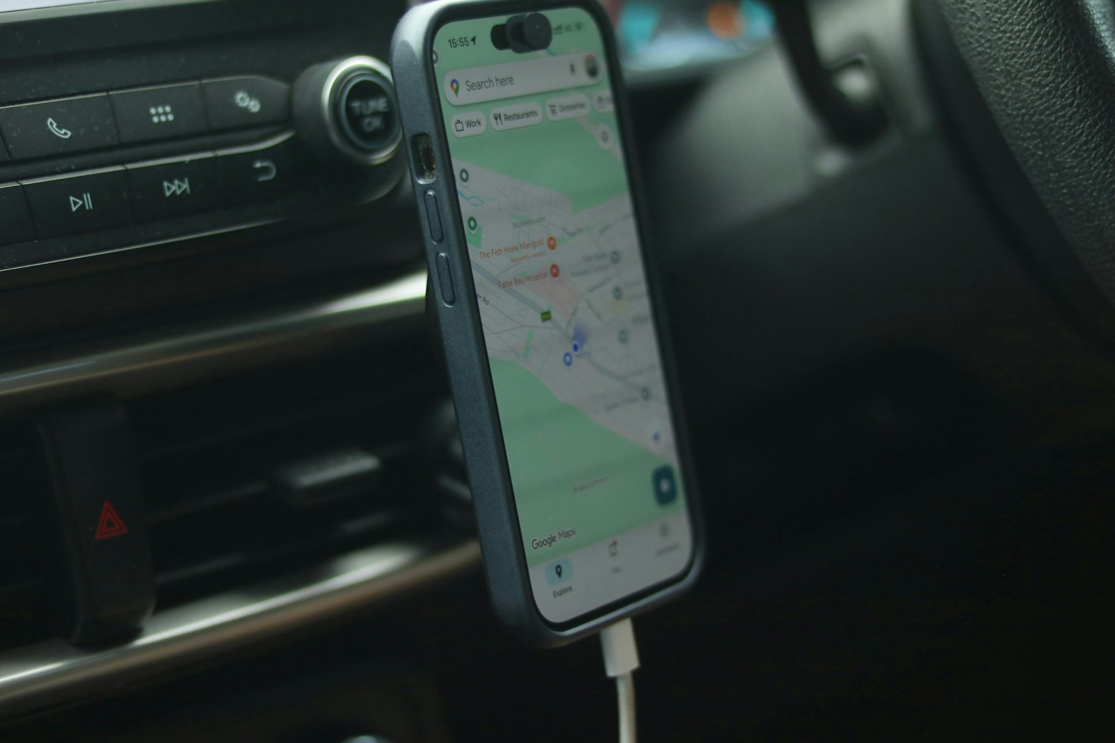 Smartphone with navigation app mounted in car