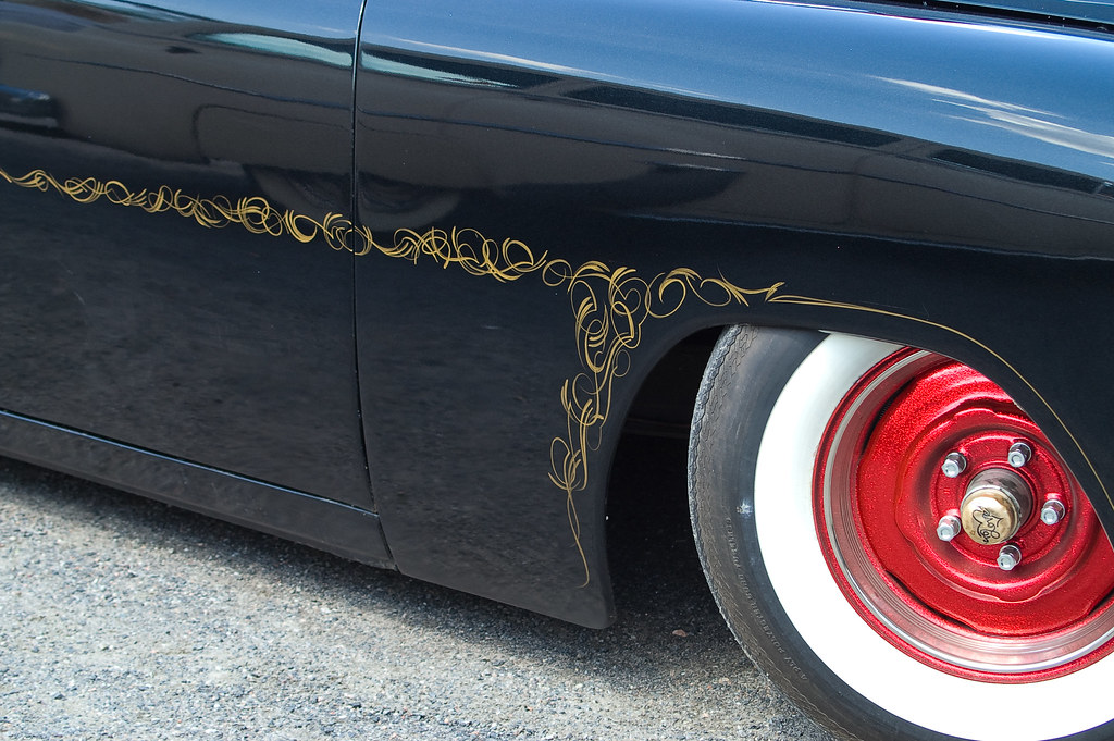 Pinstriper Demonstrates the Painstaking, Steady-Handed Process of Laying Custom Gold Leaf Striping Onto a Vintage Car