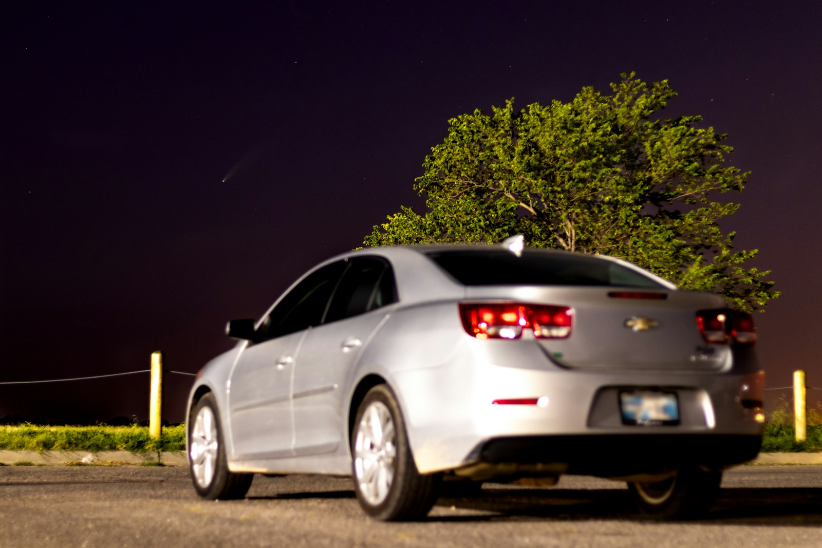 white sedan on road during night time