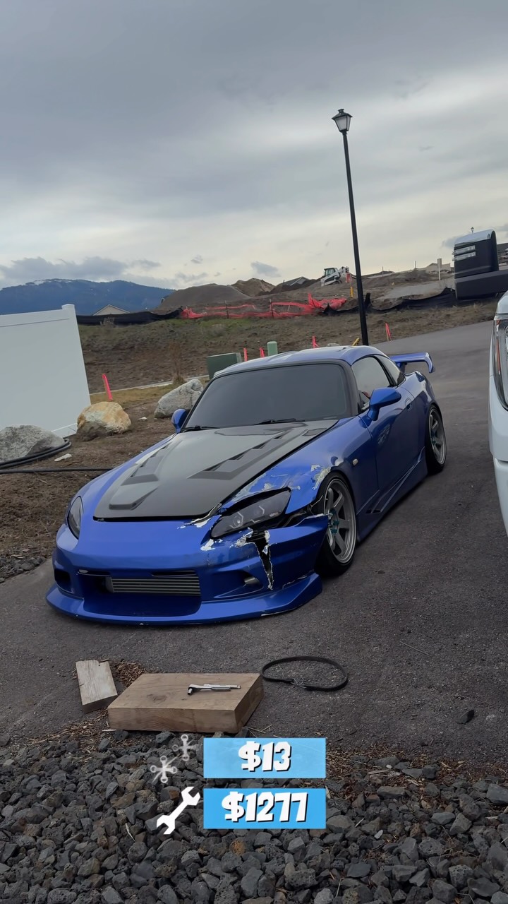 Still from an Instagram reel: a blue Honda S2000 with a damaged front corner parked in a gravel lot.