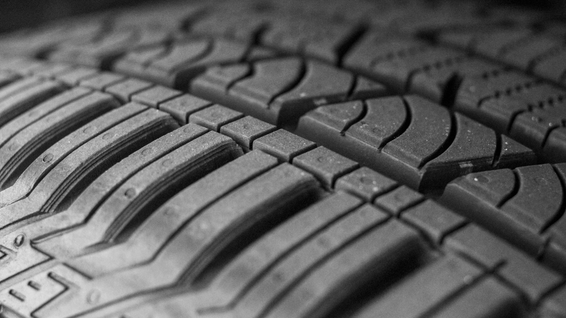 Close-up of a car tire and its tread.